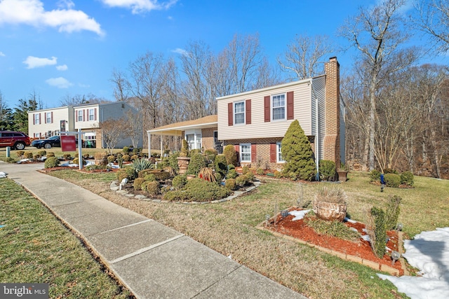 view of front of property featuring a front yard