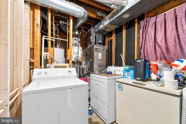 washroom featuring washer and clothes dryer and water heater