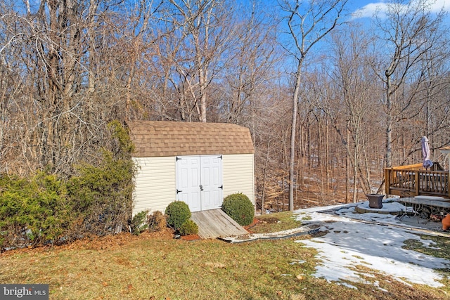 view of outbuilding with a yard