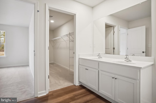 bathroom featuring vanity and wood-type flooring