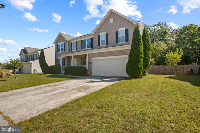 view of front facade with a garage and a front yard