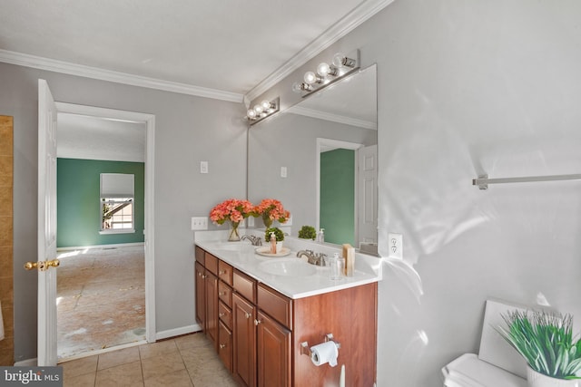 bathroom with toilet, vanity, tile patterned floors, and crown molding