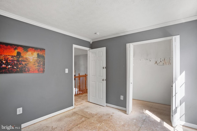 bedroom with a textured ceiling and ornamental molding