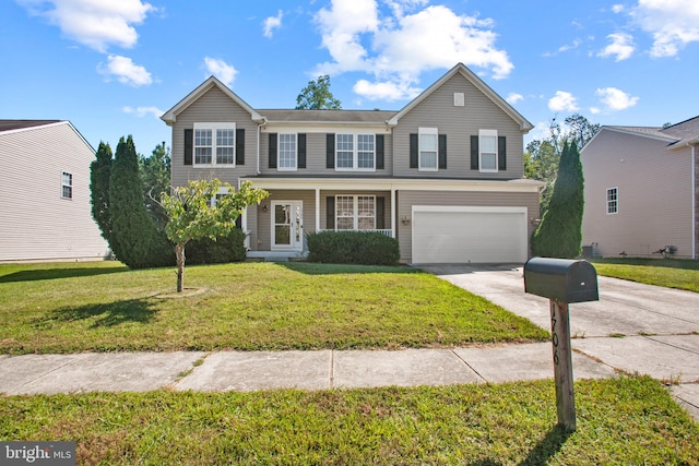 front of property featuring a front lawn and a garage