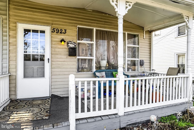 doorway to property with a porch