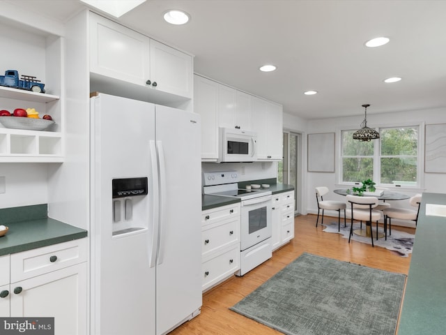 kitchen featuring white cabinetry, pendant lighting, white appliances, and light wood-type flooring