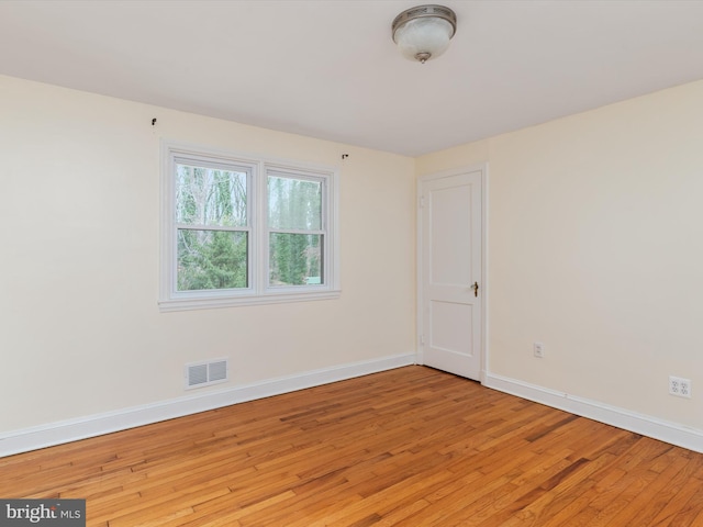 empty room with light hardwood / wood-style floors