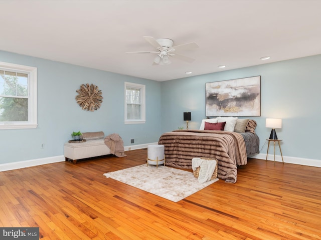 bedroom featuring ceiling fan and light hardwood / wood-style flooring