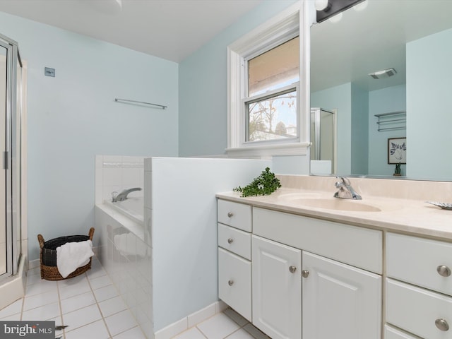 bathroom with tile patterned flooring, vanity, and independent shower and bath