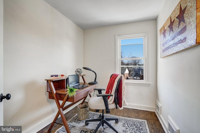 home office with dark wood-type flooring