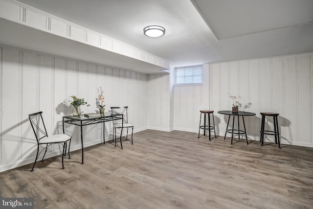 basement with hardwood / wood-style floors