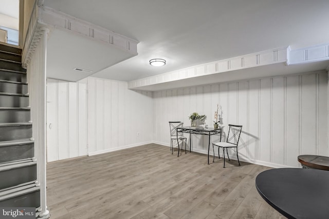 basement featuring light hardwood / wood-style flooring