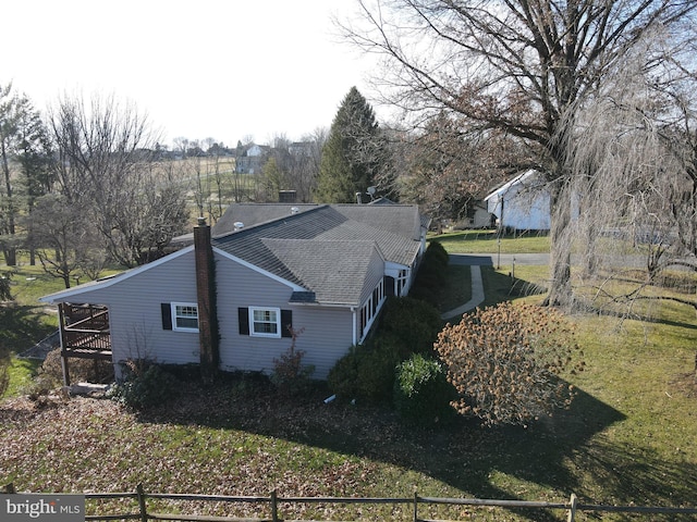 view of home's exterior featuring a lawn