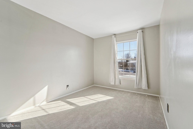 spare room with light colored carpet