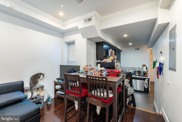 dining space featuring electric panel, dark hardwood / wood-style floors, and ornamental molding