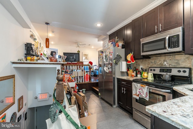 kitchen with pendant lighting, dark brown cabinets, decorative backsplash, and stainless steel appliances