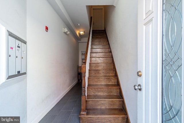 staircase with a mail area