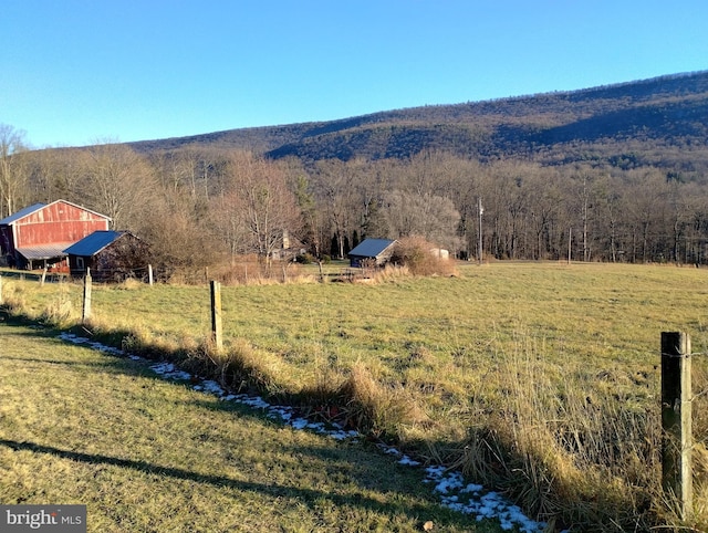 exterior space with a rural view