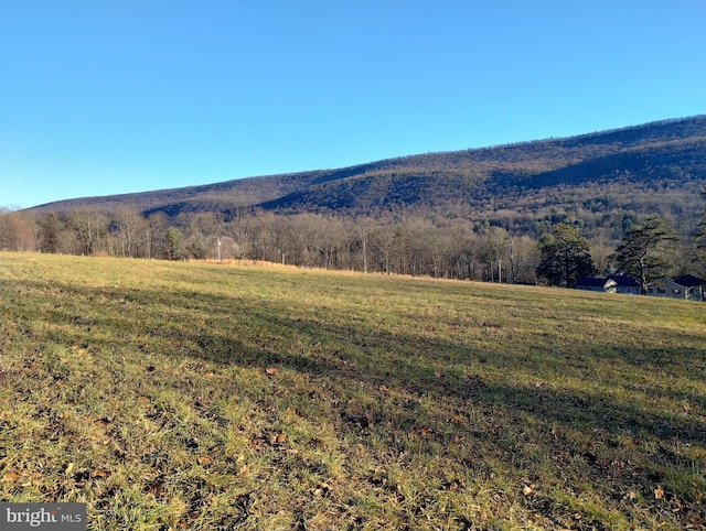 mountain view featuring a rural view