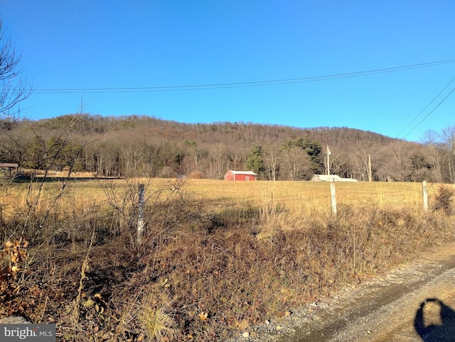 view of mountain feature with a rural view