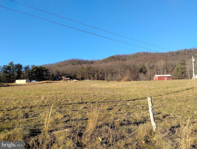 mountain view featuring a rural view