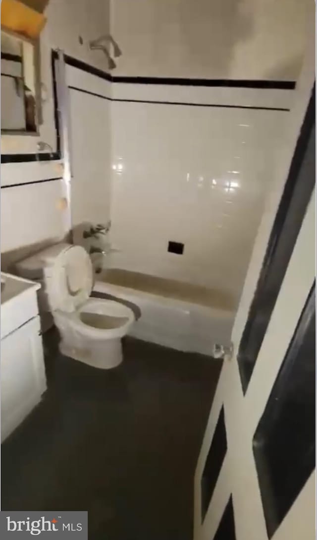 full bathroom with shower / bath combination, vanity, and toilet