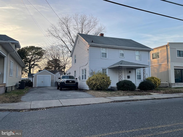 view of front of house with a shed and central AC unit