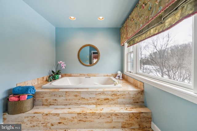 bathroom with tiled tub