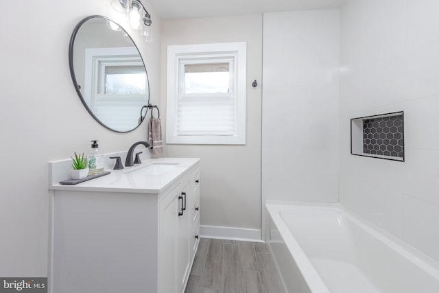 bathroom featuring hardwood / wood-style flooring and vanity