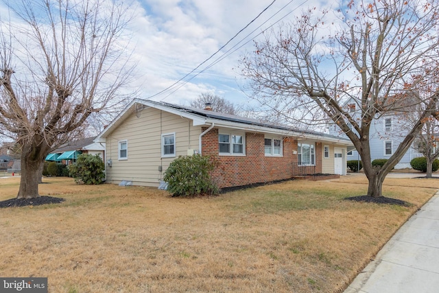 ranch-style home with a front yard