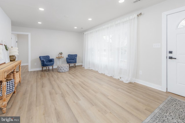 sitting room featuring light hardwood / wood-style floors