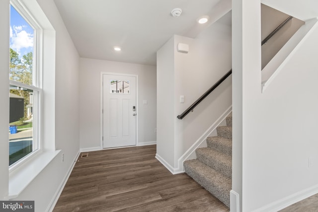 foyer entrance featuring dark hardwood / wood-style flooring