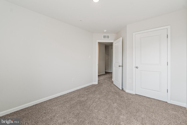 unfurnished bedroom with carpet flooring