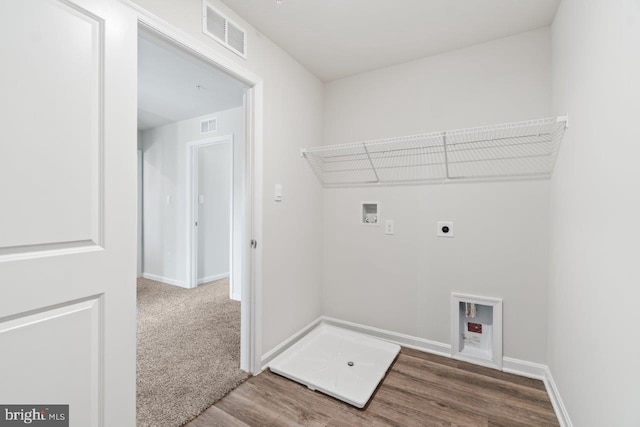 laundry area featuring hookup for an electric dryer, washer hookup, and hardwood / wood-style flooring