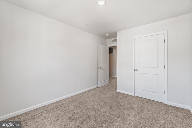 unfurnished bedroom featuring carpet