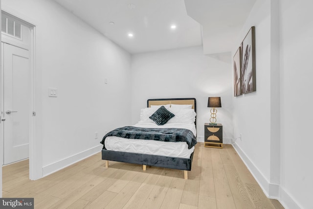 bedroom with wood-type flooring