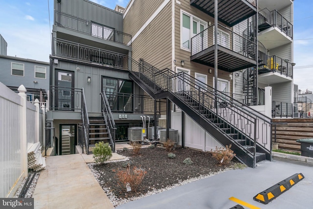 rear view of property with central AC unit