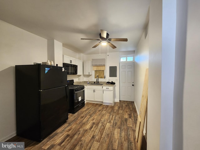 kitchen with ceiling fan, dark wood-type flooring, sink, black appliances, and white cabinetry