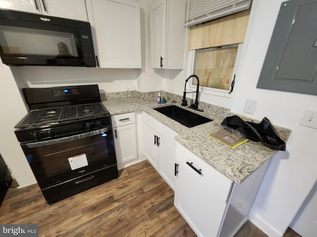 kitchen featuring light stone counters, sink, black appliances, dark hardwood / wood-style floors, and white cabinetry