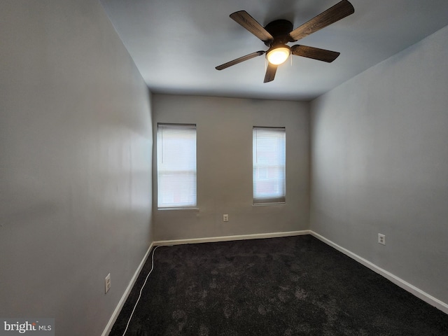 carpeted empty room featuring ceiling fan