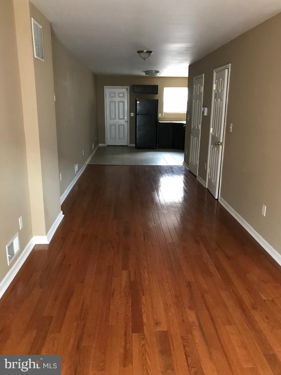 interior space with dark hardwood / wood-style floors