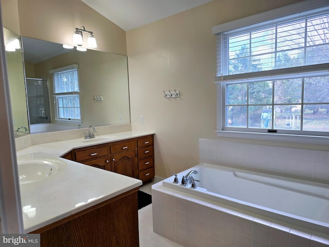 bathroom with separate shower and tub, tile patterned floors, vanity, and lofted ceiling