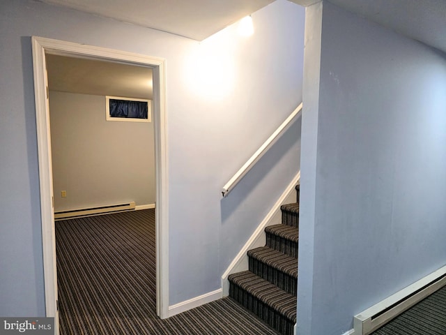 stairs with carpet and a baseboard radiator