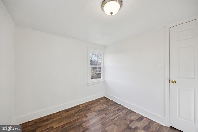 empty room with dark hardwood / wood-style floors