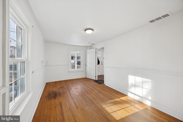 empty room with hardwood / wood-style flooring