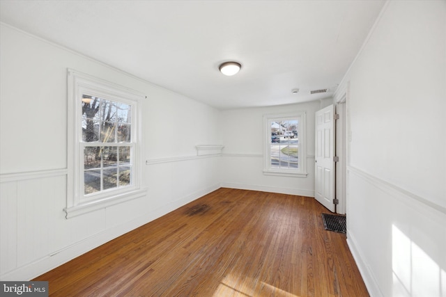 empty room with hardwood / wood-style floors