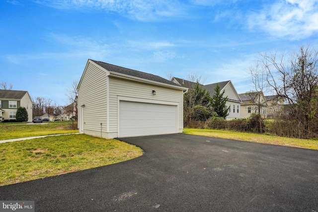 exterior space featuring a yard and a garage