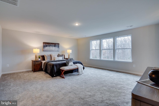 bedroom featuring light colored carpet