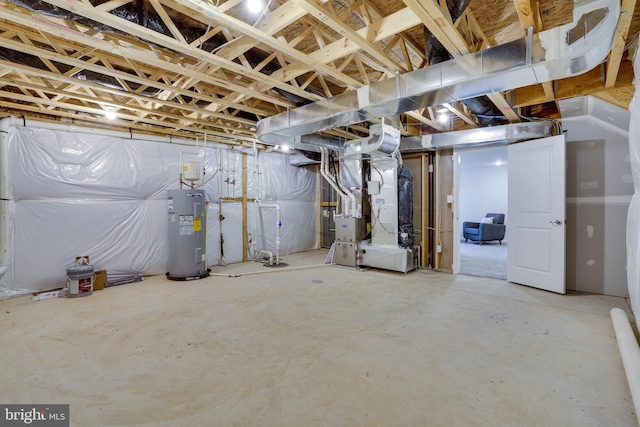 basement featuring electric water heater and heating unit