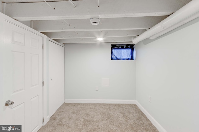 basement with light colored carpet